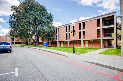A brick, three-story building that is Davis Apartments.